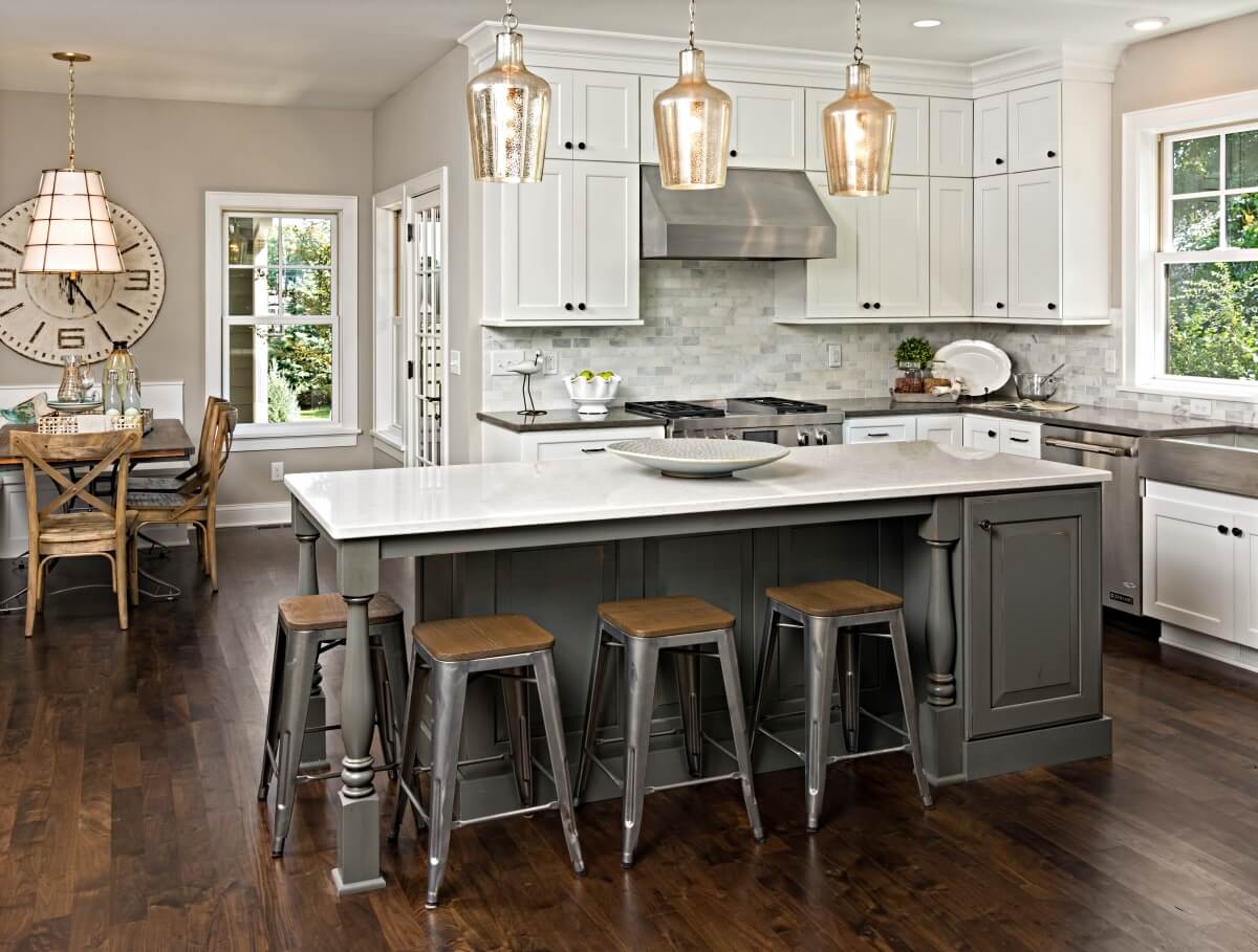 A two-tone kitchen with gray kitchen cabinets.