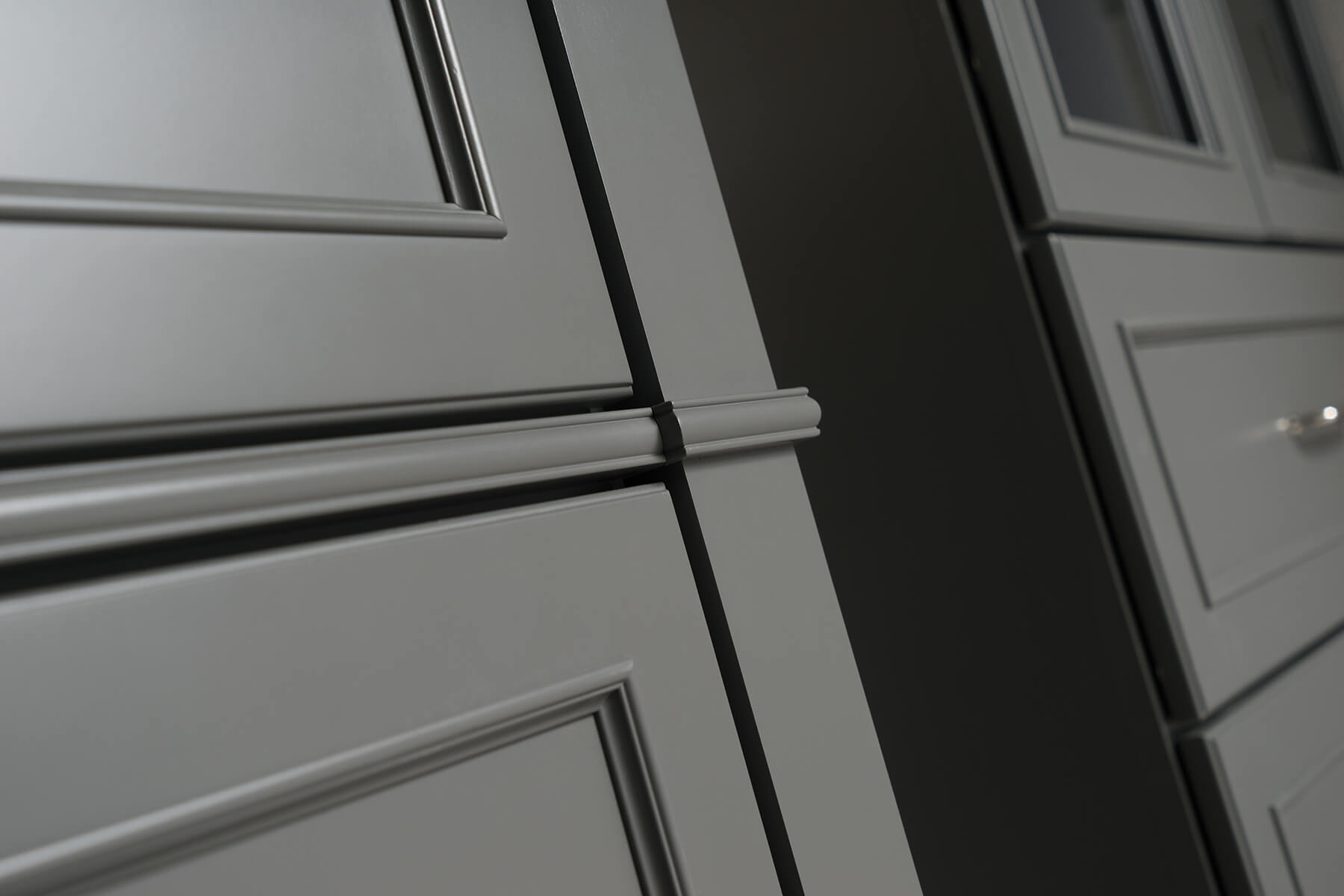 Dark gray painted bathroom vanity cabinets from Dura Supreme Cabinetry.