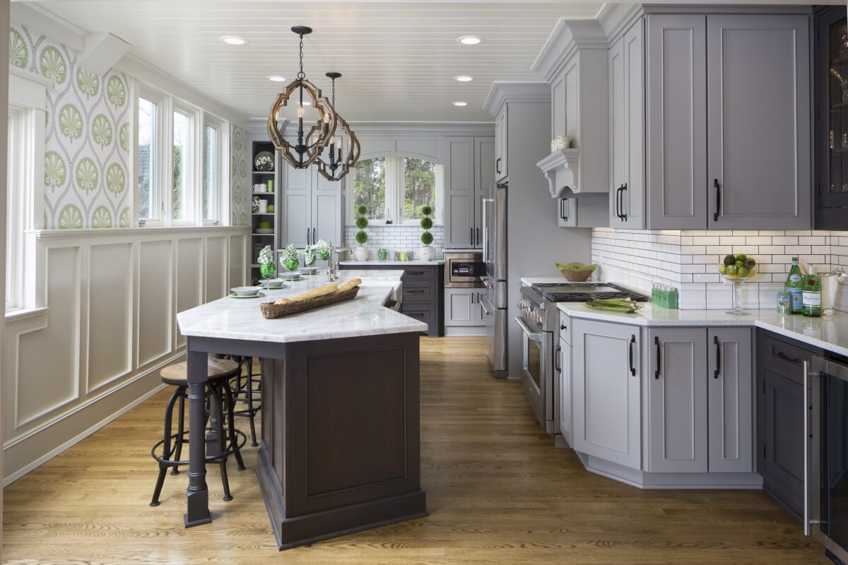 A historic home with a remodeled kitchen that has a gray color scheme.