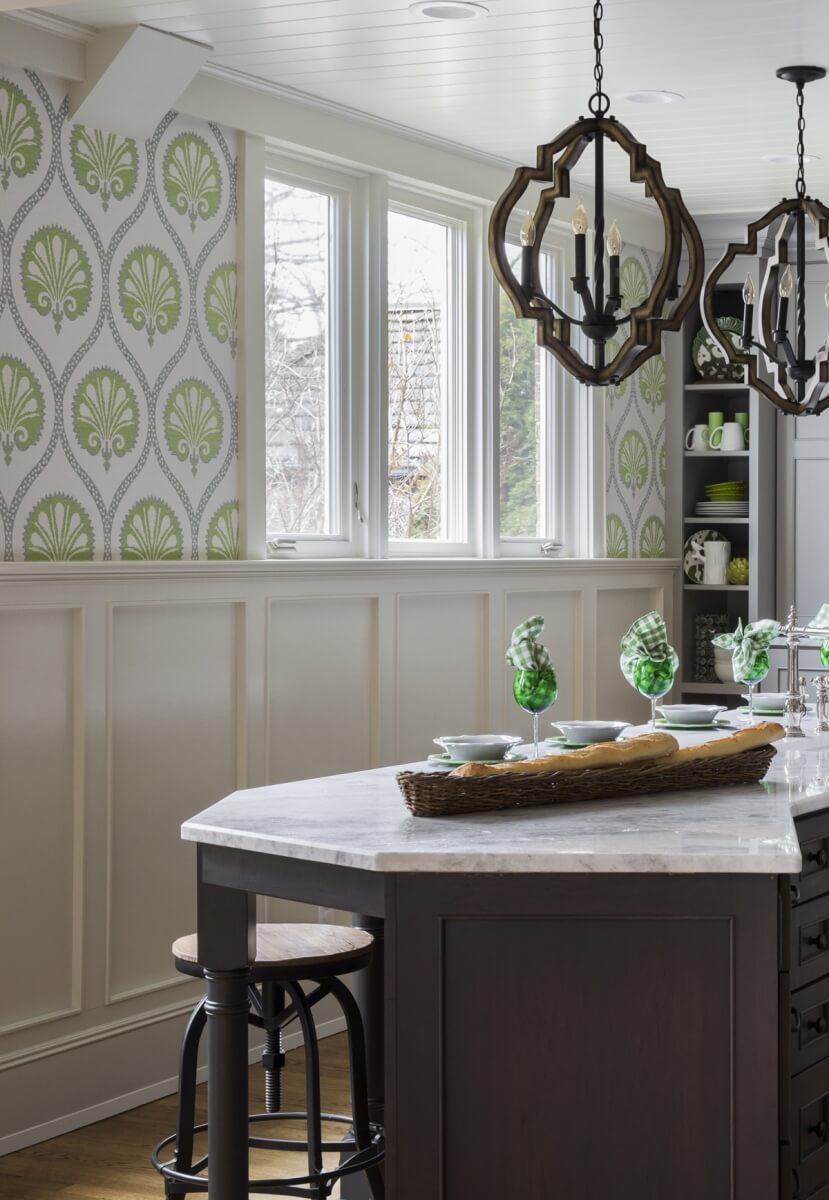 Elegant green and white wall paper in a traditional kitchen with a gray stained kitchen island.