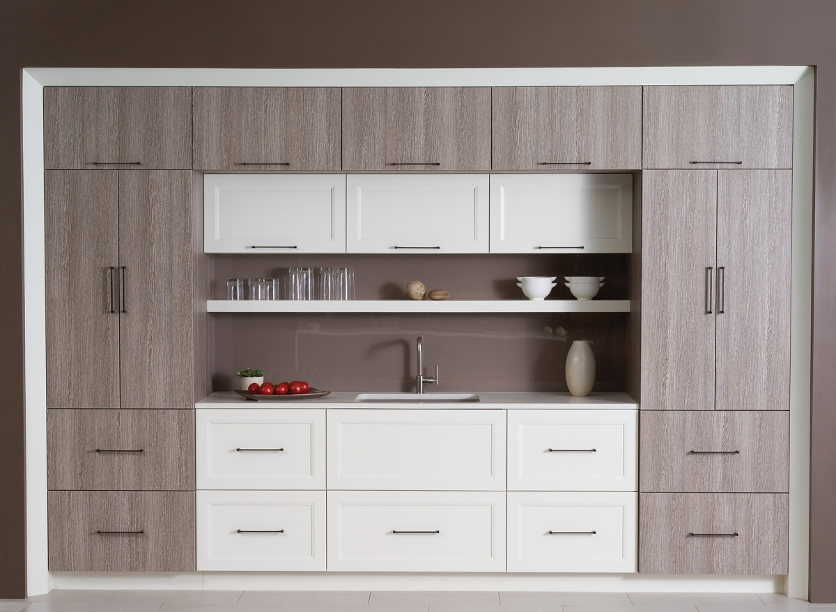 A modern textured kitchen design with a framed in kitchen sink.