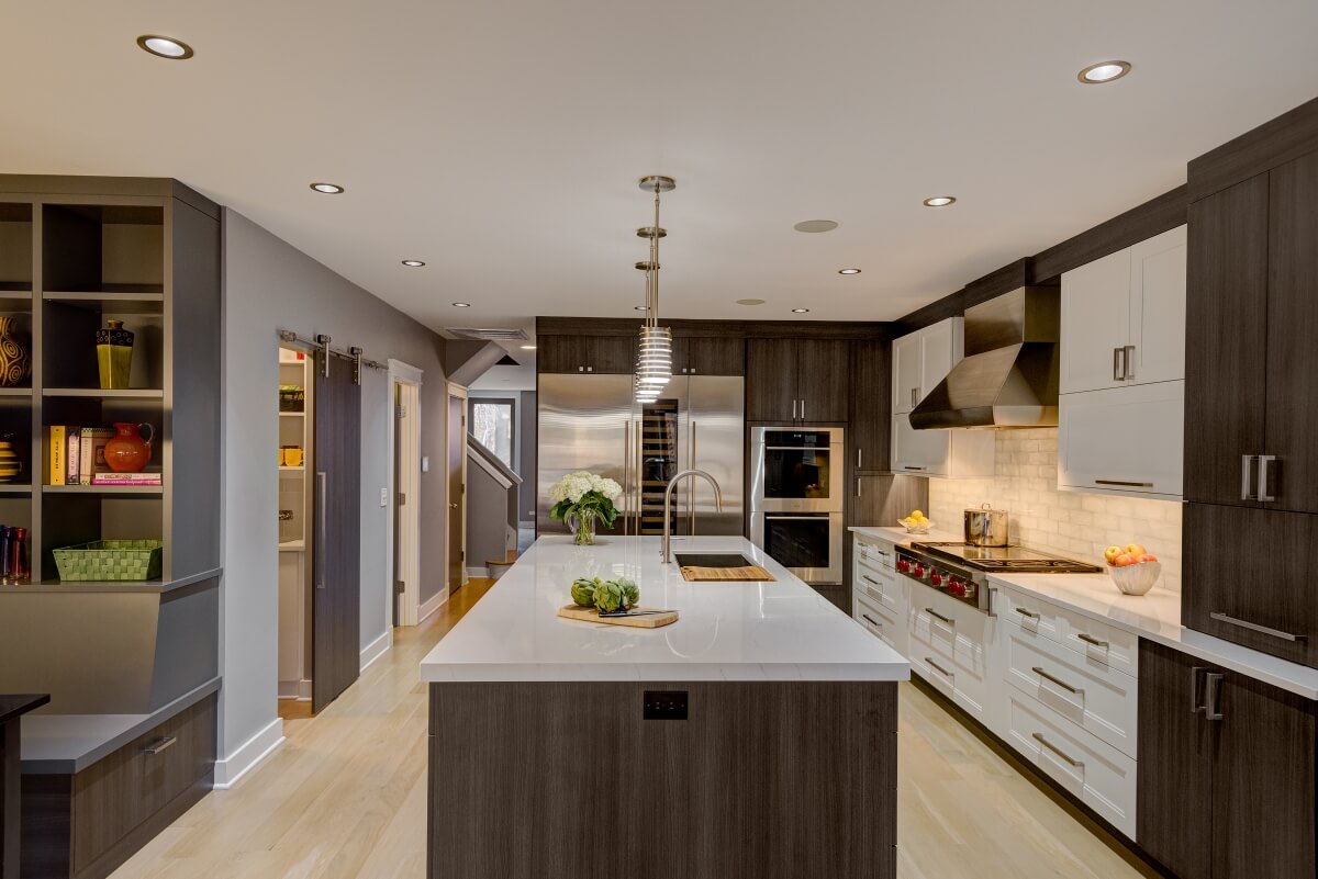 Full view of entire modern kitchen with two-toned cabinets from Dura Supreme Cabinetry.