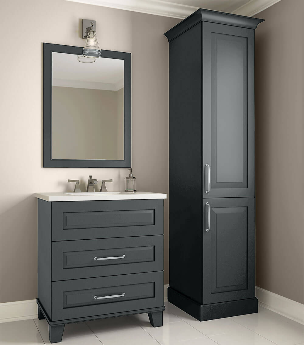 A custom designed bathroom furniture collection with dark gray painted cabinets, vanity, linen cabinet, and vanity mirror from Dura Supreme.