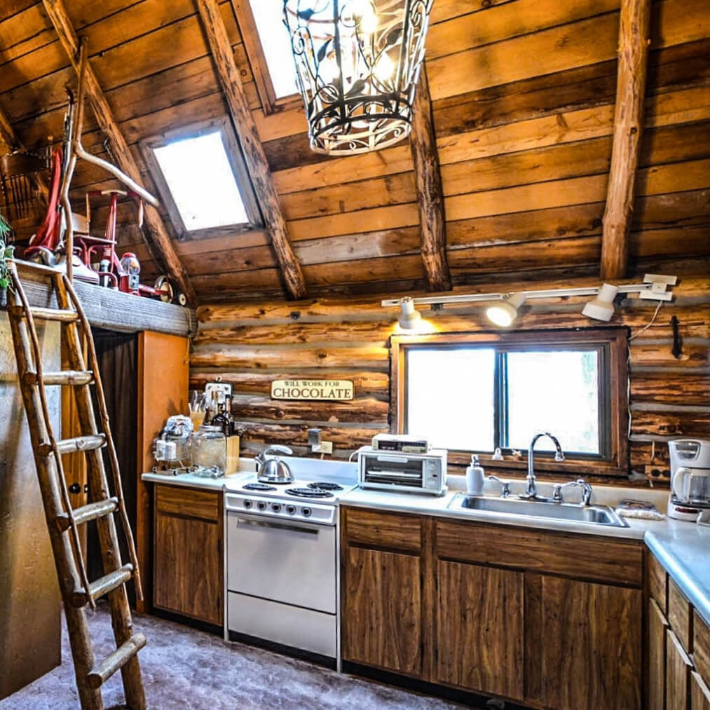 A rustic old-sdtyled kitchen with HIckory cabinets.