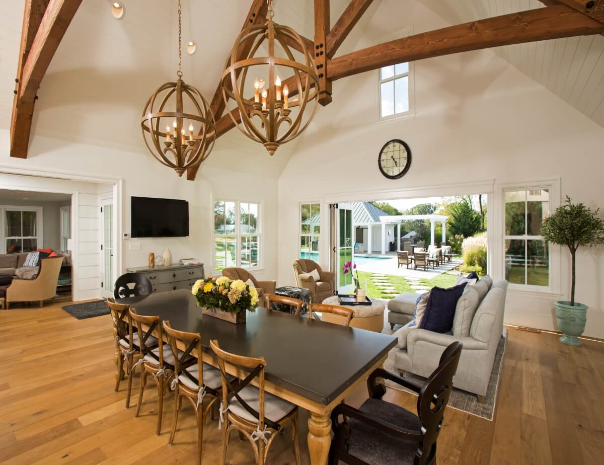 The farmhouse table, with mixed seating and the X motif on the chairs