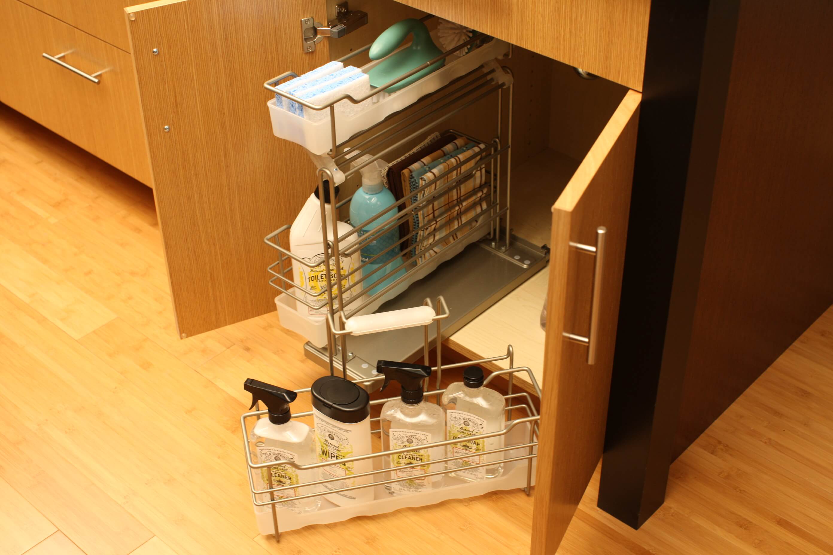 Organize cleaning supplies in our convenient pull-out caddy with detachable, portable basket (SBPOC) from Dura Supreme Cabinetry.