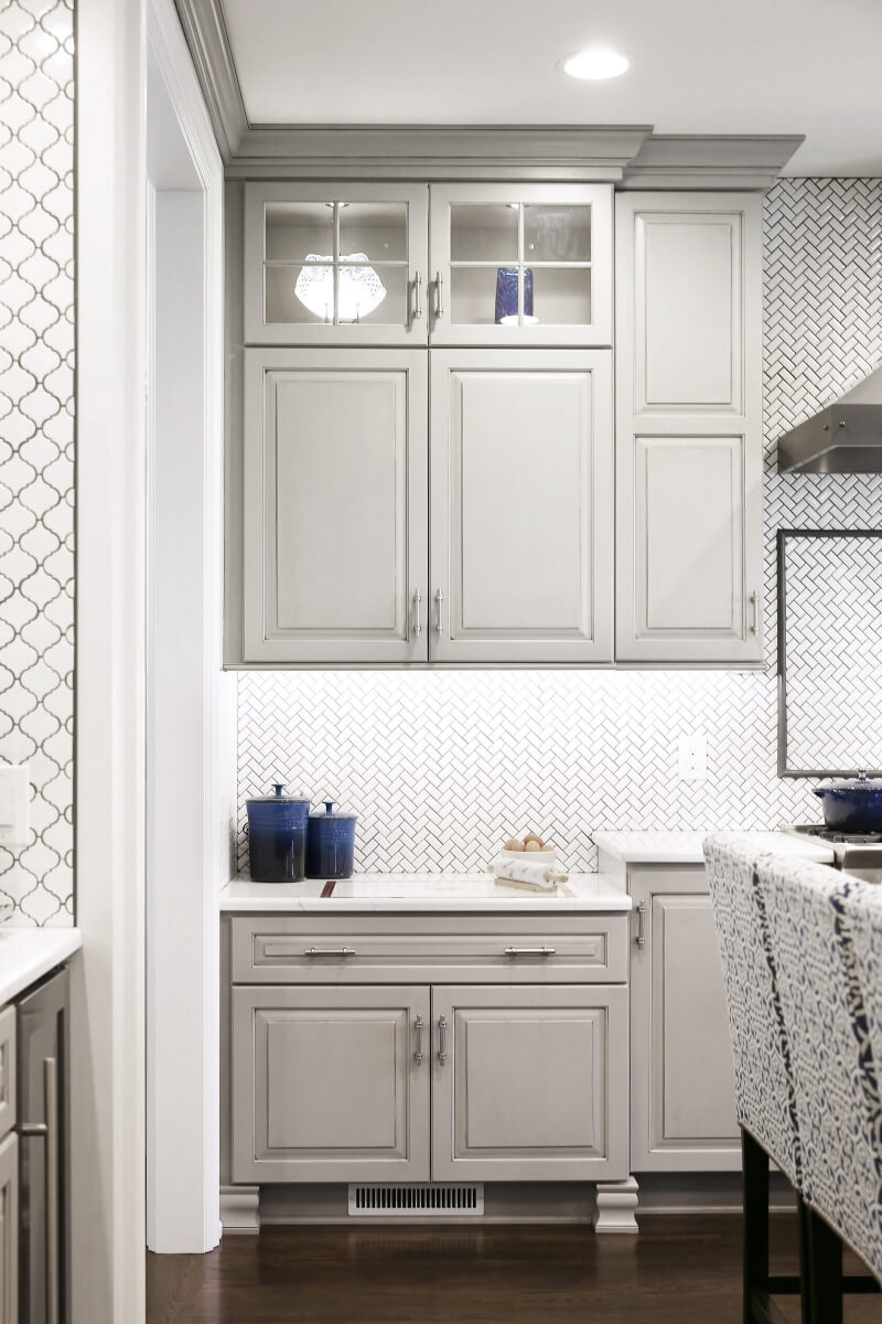 The baking center space has a lower countertop to make food prep easier for the homeowner.