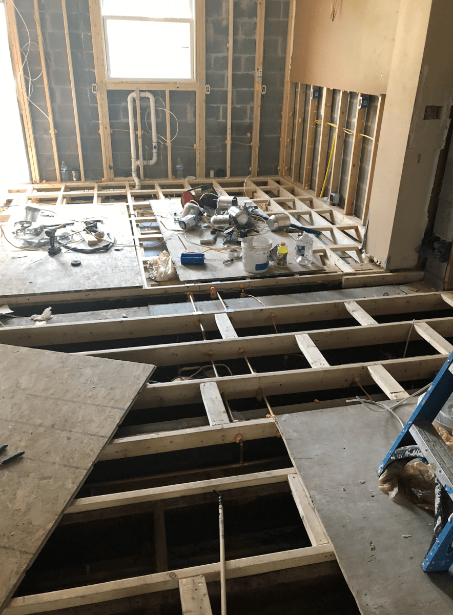 To solve the issue of the floor slope, contractors sistered the floor joists along the entire first floor to set a solid foundation for the new flooring and cabinetry.