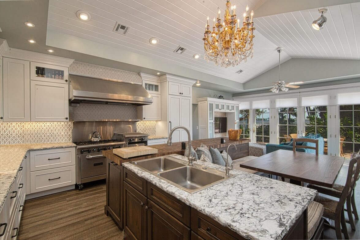 Dura Supreme Cabinetry, view of hand-made tile by Julep Tile, family heirloom chandelier, designer Bianca Fathauer of Splendid Home Design, photographer Kaunishetki