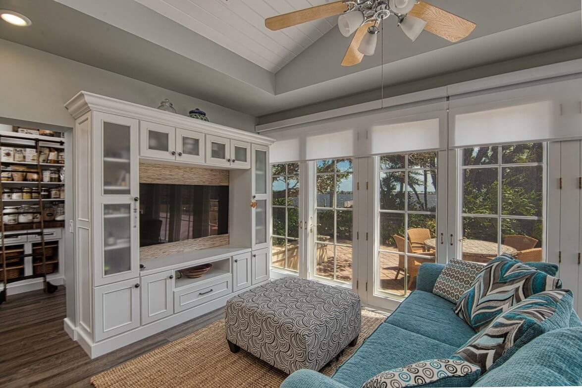 Waterfront Backyard View from Kitchen, Dura Supreme cabinetry in Entertainment Center and Pantry, designer Bianca Fathauer of Splendid Home Design and photographer Kaunishetki