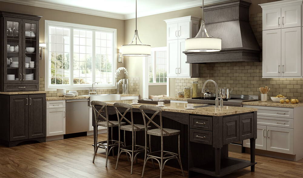 A modern farmhouse style kitchen with white painted kitchen cabinets and weathered wood kitchen island cabinets, wood hood, and accent kitchen cabinets from Dura Supreme Cabinetry.