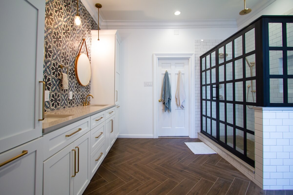 This attractive bathroom is a fantastic example of considering where your entry door is located in the space. Notice how there is plenty of room for the user to enter without the door colliding into the main bathroom fixtures.The Bathroom was designed by Devin Mearing of dRemodeling, Philadelphia PA.