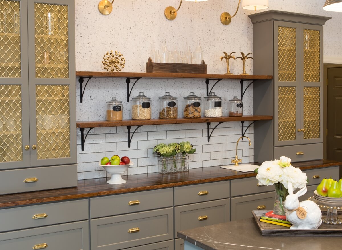 Gold accents set the stage for this dazzling Dura Supreme hutch designed by Michelle A. Lecinski of Advance Design Studio, Ltd., Gilberts, IL