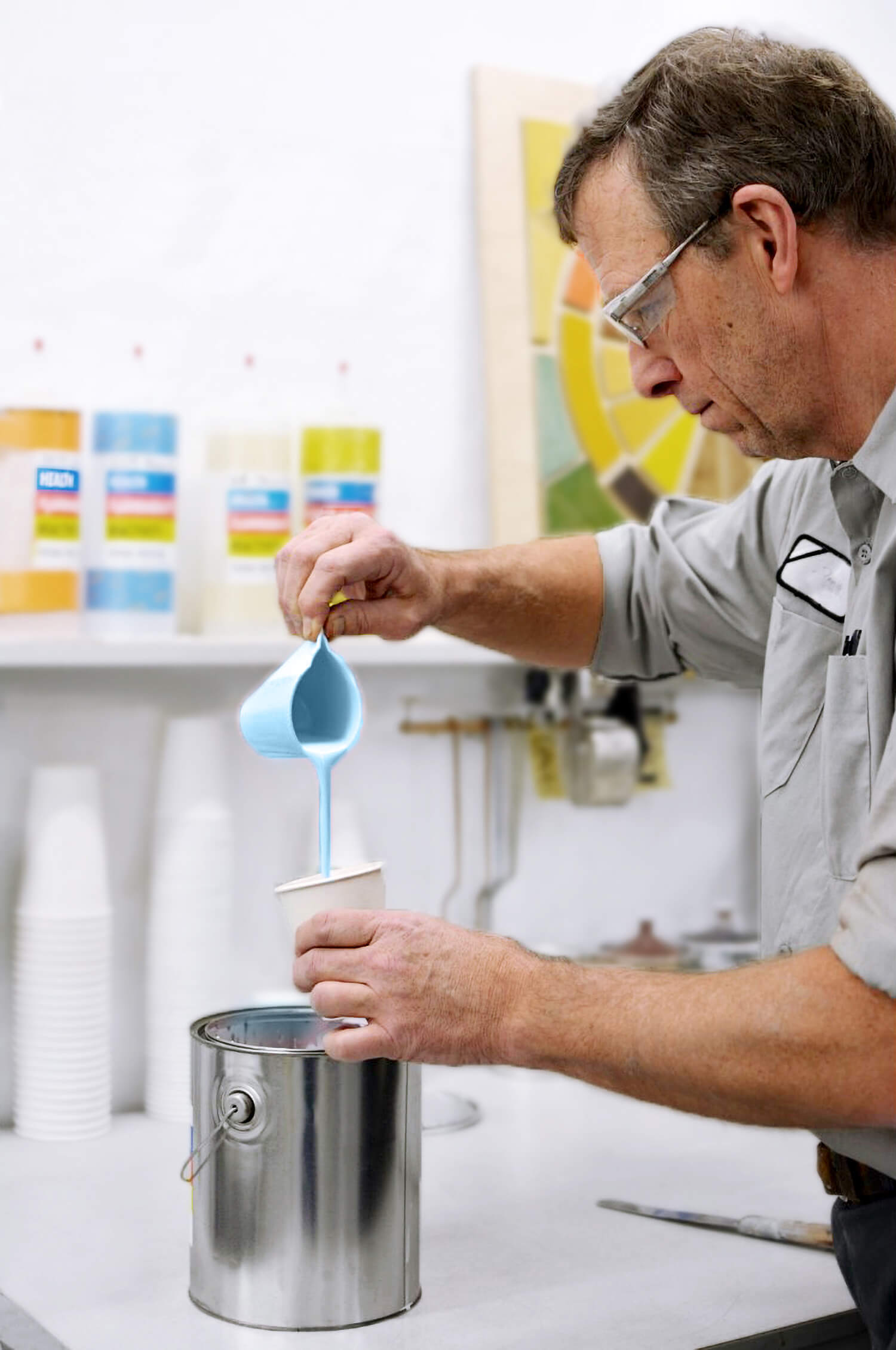 A paint Lab Tech hard at work crafting custom colors for cabinetry at Dura Supreme Cabinetry.