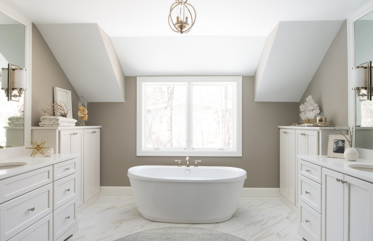A warm, neutral bathroom featuring Dura Supreme's Kendall Panel door style in 
