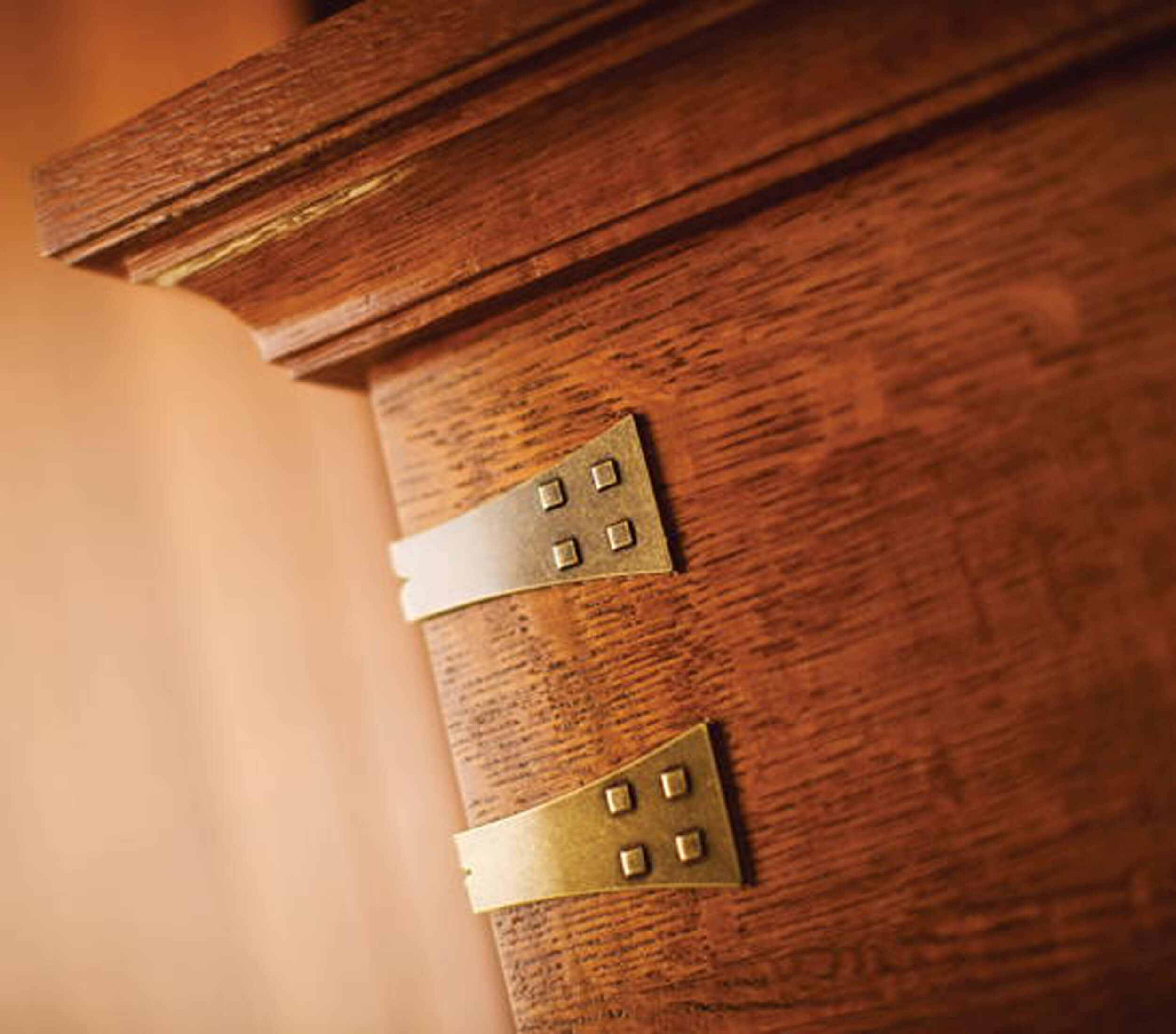 Cabinet bracket embellishments on the corners of the craftsman styled wood hood add just the right craftsman detail to this kitchen design.