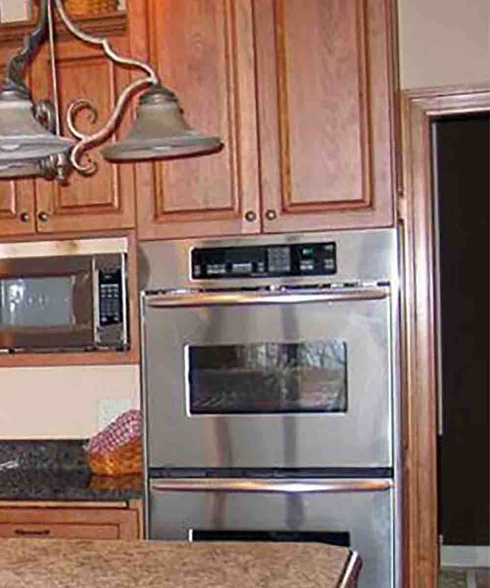 Remember to leave room between the cabinetry and architectural details such as the door casing to the right of the oven cabinet.