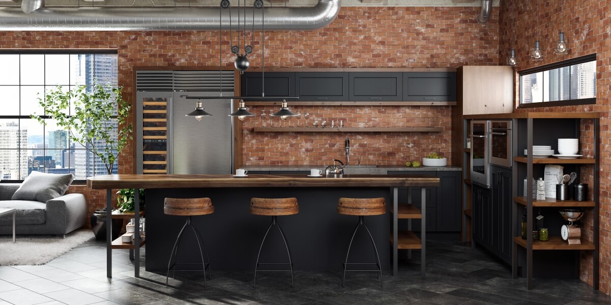 An Industrial style kitchen design in an urban loft with exposed brick walls and ductwork. The modern and rustic cabinets use a black painted finish and accents in a wood with a warm stain. Open shelves and black metal fixtures add to the style.