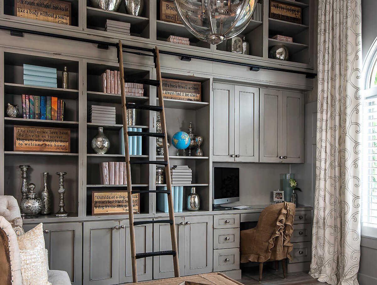 A home library and home office design with shabby chic styled bookcases.
