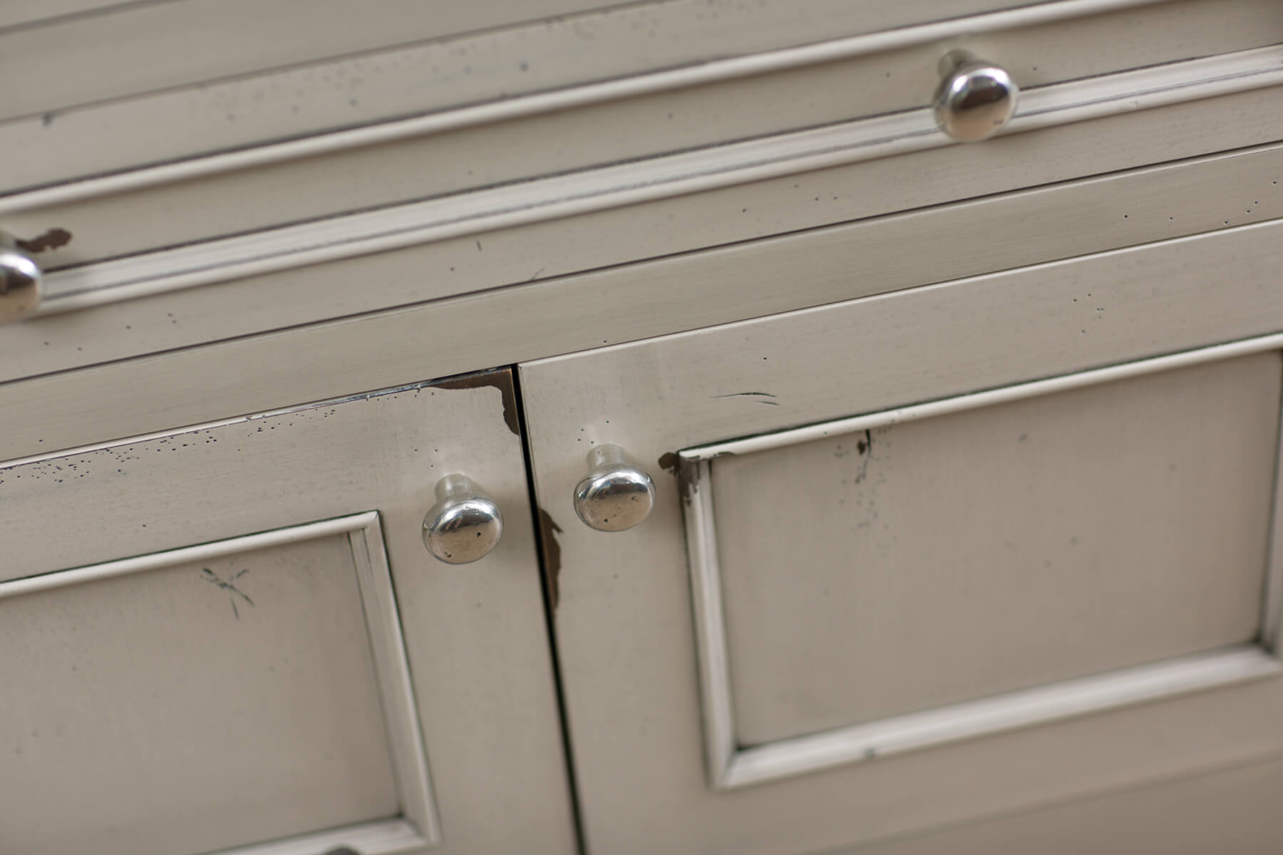 A kitchen island with a beautiful distressed paint finish with Dura Supreme's Heritage Paint finish.