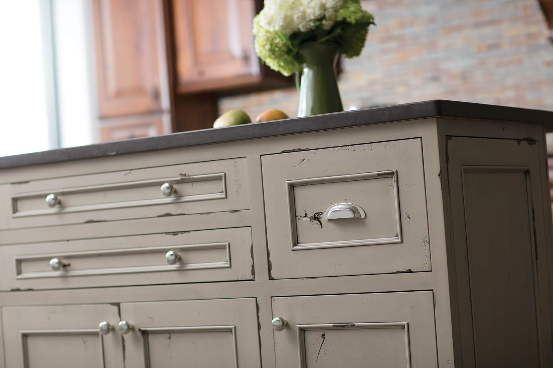 A kitchen island with a beautiful distressed paint finish with Dura Supreme's Heritage Paint finish.