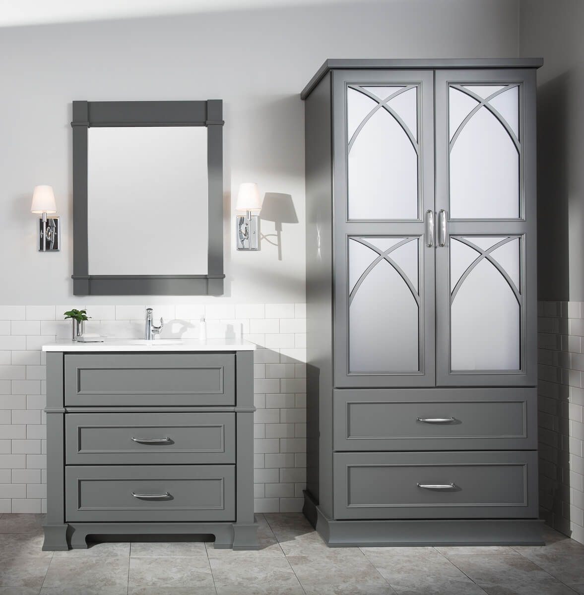 Dark gray bathroom vanity and linen cabinet in a modern bathroom design. Remodeled with a timeless look in mind.