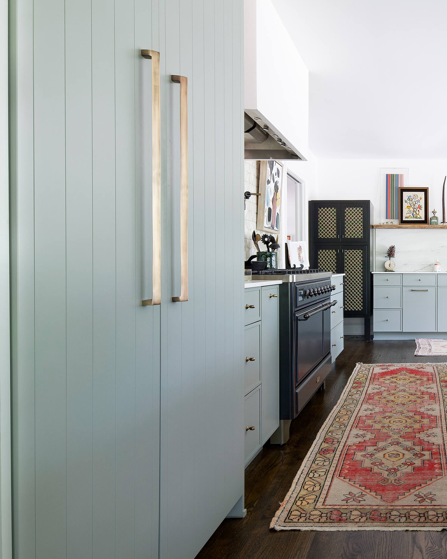 A panel-ready fridge featuring two different door styles. One with a shiplap slab detail and the other with a micro, skinny shaker style.