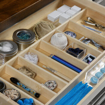 A Wide Cutlery Tray Divider for Other Rooms. Dura Supreme Cabinetry drawer storage solutions with dividers.
