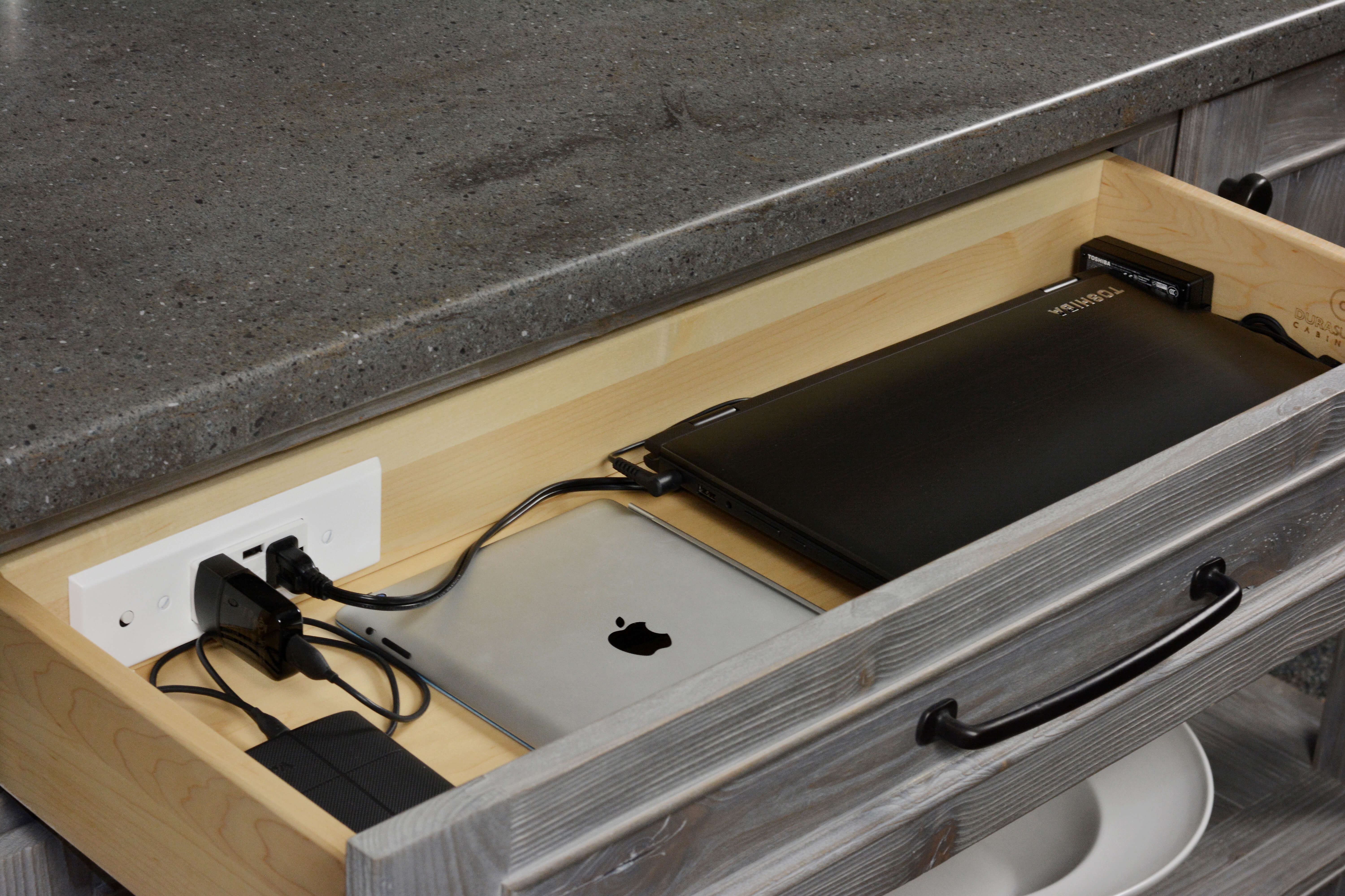 Kitchen and Bath cabinetry storage with power. Drawer Charging Station by Dura Supreme Cabinetry.