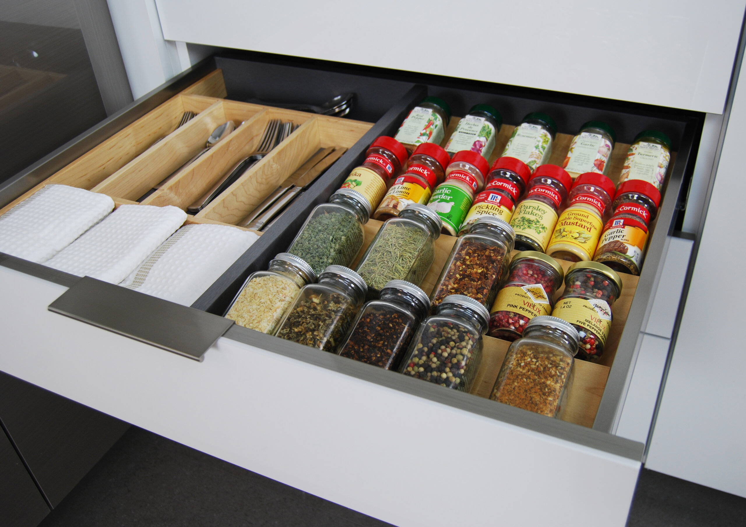 Dura Supreme's wood Drawer Spice Rack can be used in combination with our stainless steel drawer options.