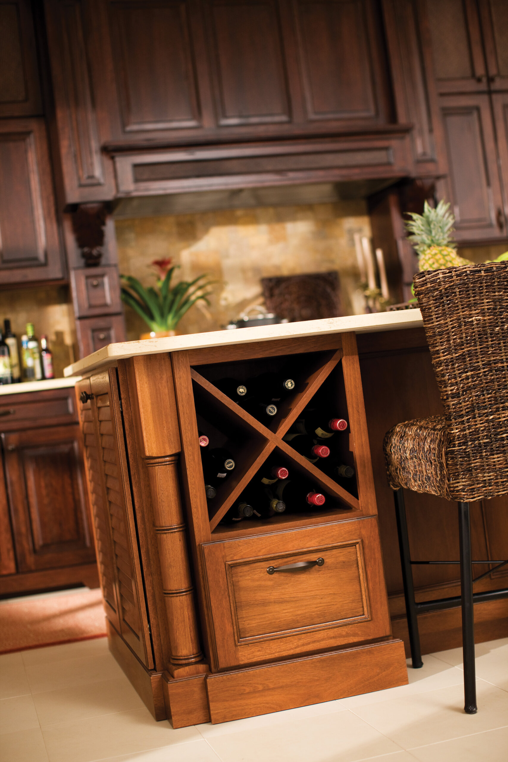 A base kitchen cabinet with a large x wine rack and a drawer below shown on a kitchen island.