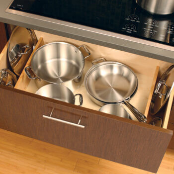 How to organize pot and pan lids with organized kitchen cabinet drawers. Lid Storage Partition storage accessory by Dura Supreme Cabinetry.