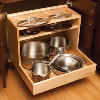 An entire cookware collection can be organized neatly in this single pull-out that houses pots and pans in the lower section and organizes lids above.