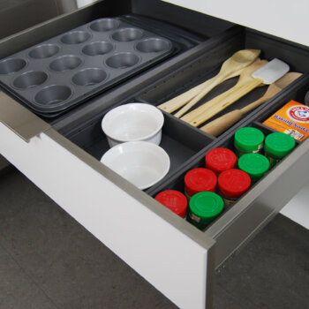 Dura Supreme stainless steel kitchen drawer utensil organizer with divided partitions.