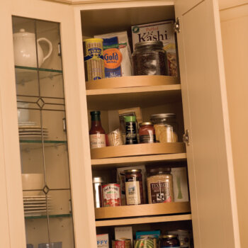 Kitchen Corner Cabinet Storage Ideas from Dura Supreme Cabinetry. A corner lazy susan in a wall cabinet.