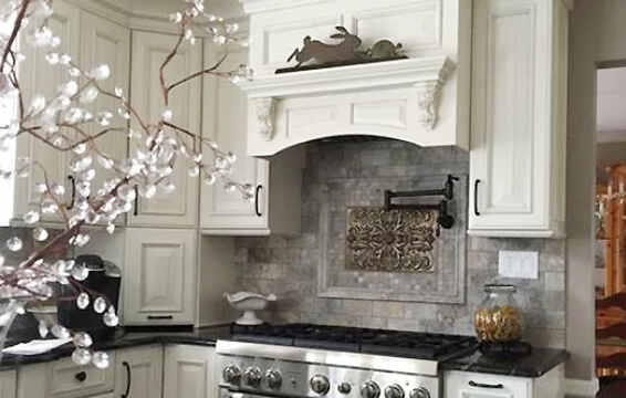 The best cabinet brand! This beautiful new kitchen has a classic wood hood and traditional raised panel cabinet doors.