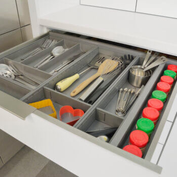 Stainless Steel Cutlery Divider Tray and Utensil Organizers from Dura Supreme Cabinetry. Modern metal kitchen drawer dividers and storage ideas.
