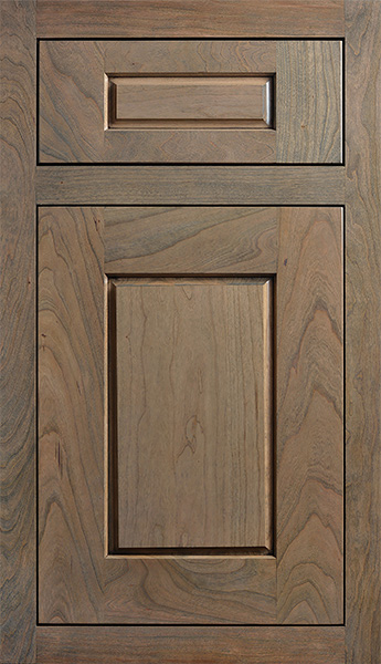 An inset cabinet door with a medium, true-brown stained finish on cherry wood. Finding the right cabinetry for your home will depend on a number of key factors. Your tastes, the purpose and location of the cabinets, your budget, and more will all contribute to the process.