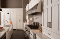 An casual styled kitchen with frameless kitchen cabinets with white and beige painted finishes.