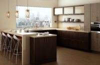 A city loft apartment with a stunning view and modern cabinets in a sleek and contemporary kitchen design. Featuring Dura Supreme frameless cabinets.