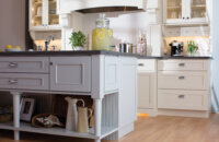 This cottage styled kitchen design mixes 3 door styles. Mixing Dura Supreme's Craftsman Panel and Craftsman Beaded Panel for the perimeter and Silverton on the kitchen island.