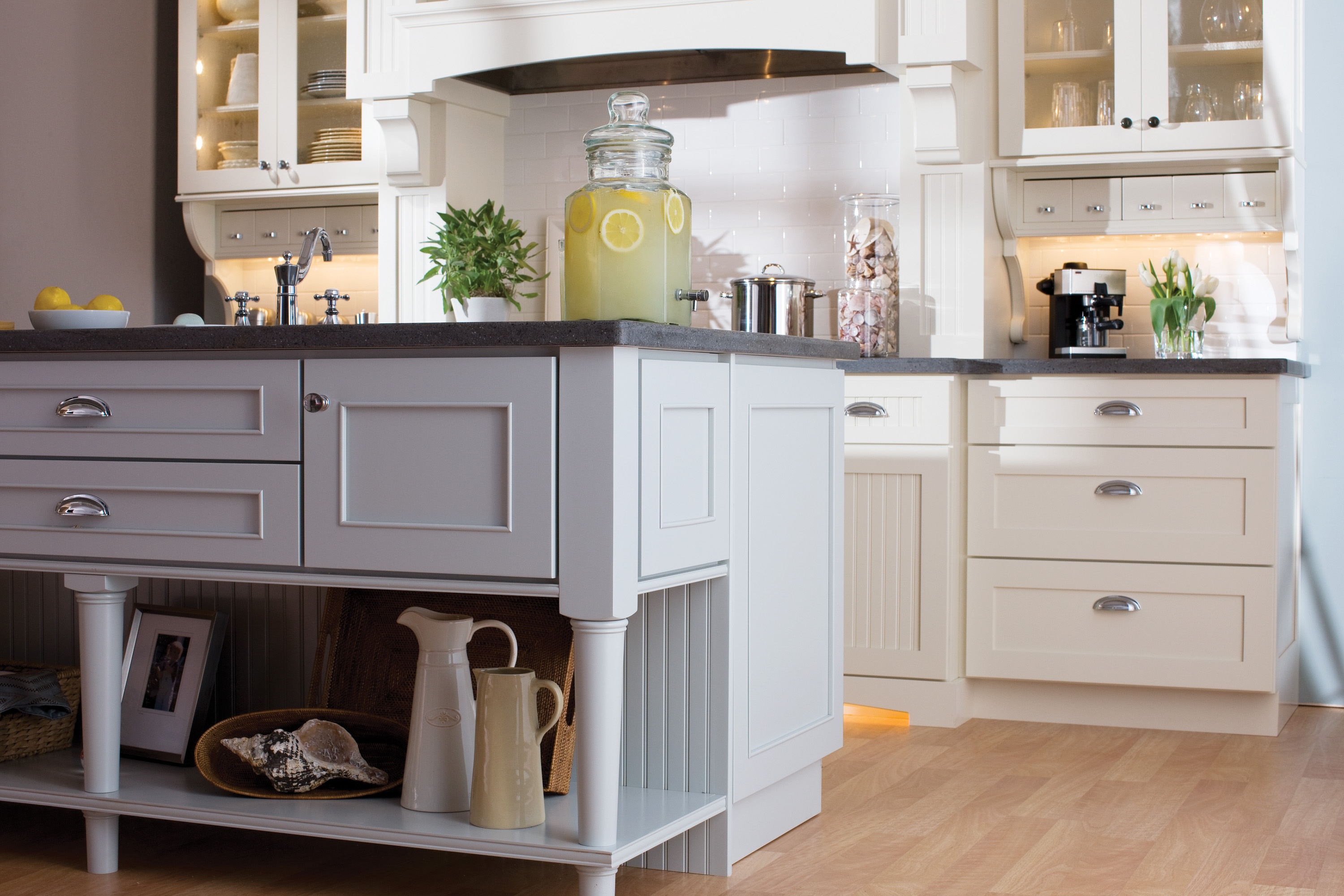 This cottage styled kitchen design mixes 3 door styles. Mixing Dura Supreme's Craftsman Panel and Craftsman Beaded Panel for the perimeter and Silverton on the kitchen island.