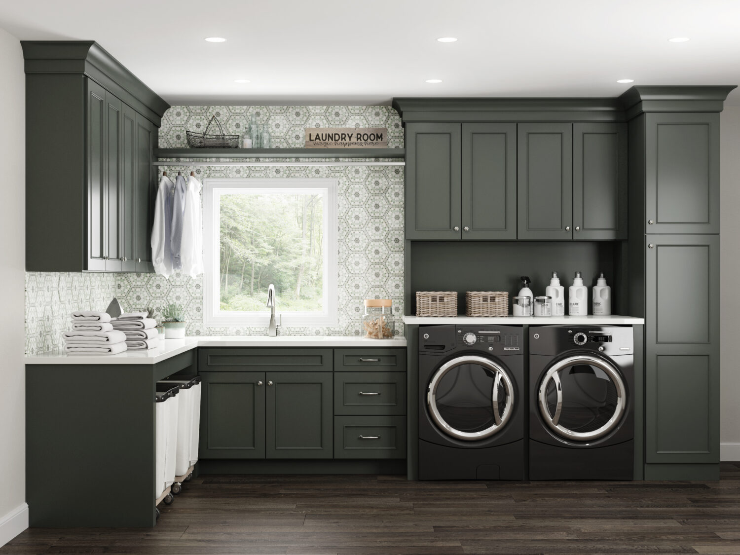 Dark olive green painted cabinets with a custom paint match finish using Dura Supreme's Personal Paint Match program to perfectly match the finish to Sherwin-Williams Rock Bottom paint color. A detailed hand-painted backsplash tile complements the color of the cabinetry throughout the room.