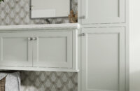 This master bathroom design uses a light gray finish that is almost white that perfectly coordinates with the tile the homeowner selected.