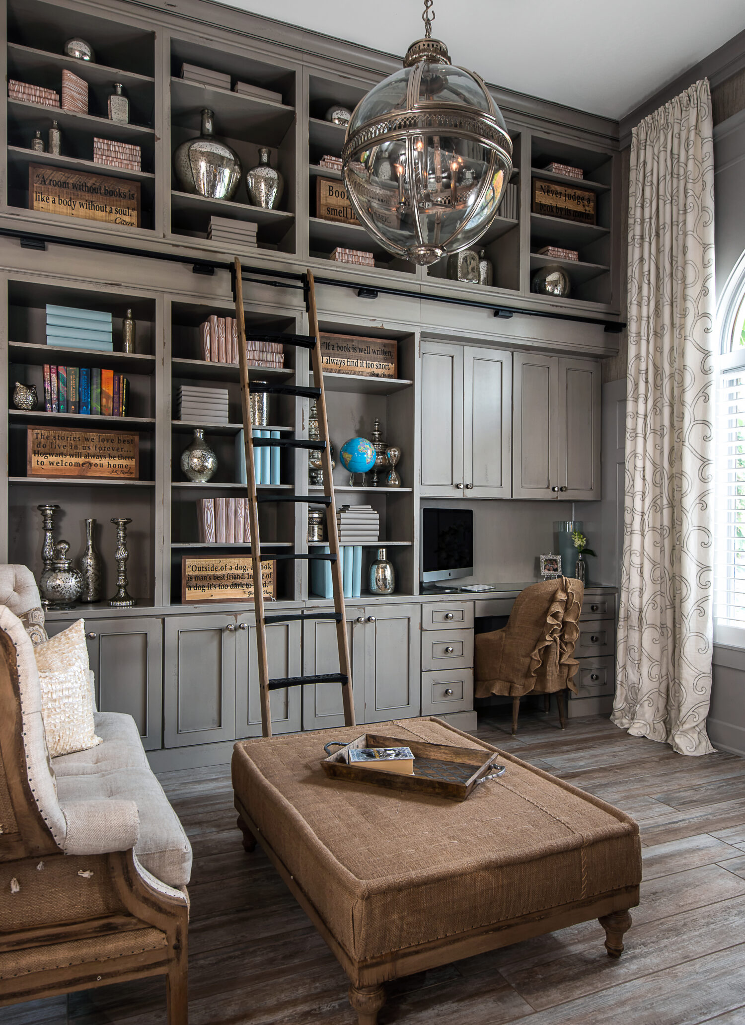 Shabby Chic styled home office and library with floor to ceiling book cases and mobile ladder.