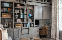 Shabby Chic styled home office and library with floor to ceiling book cases and mobile ladder.