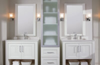 Dual vanities and a free standing linen cabinet between them make a coordinating bathroom furniture set.