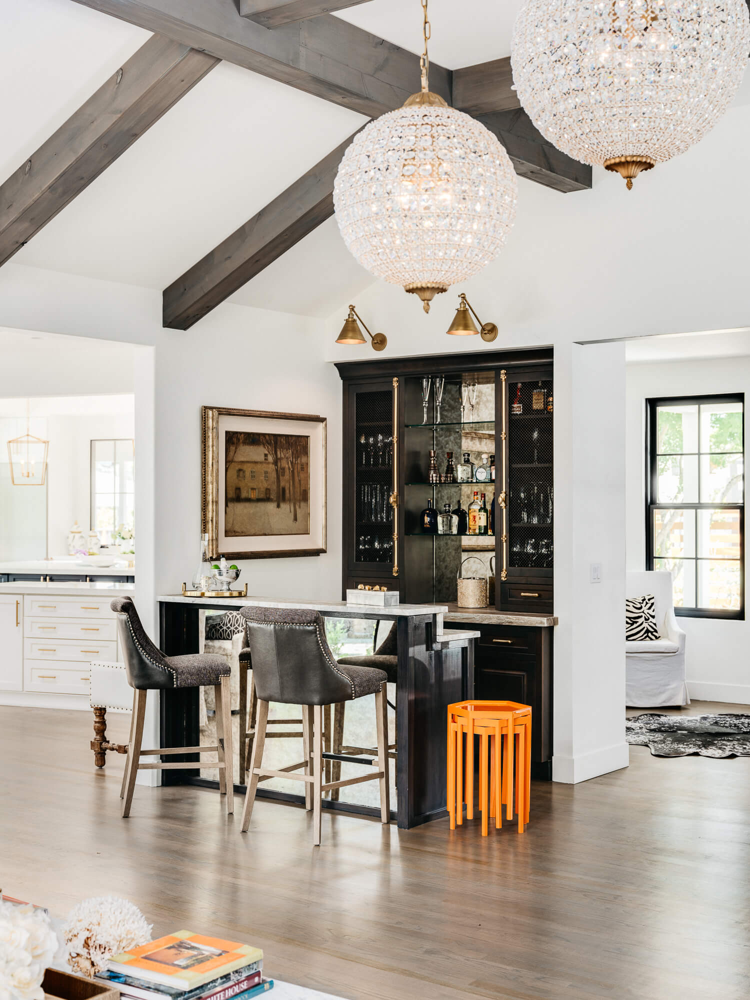 Dura Supreme wet bar featuring mirror as a backsplash and at the foot-space of the bar seating space.