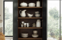 Dura Supreme Cabinetry Storage Larder shown used for dishware.