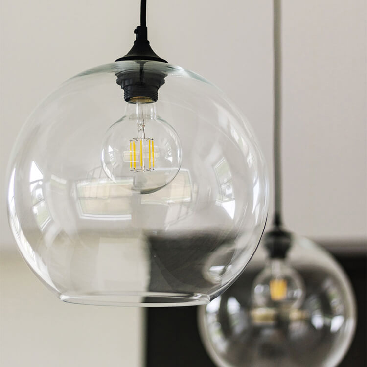 Close up of modern pendant lighting above a ktichen island in a kitchen remodel.